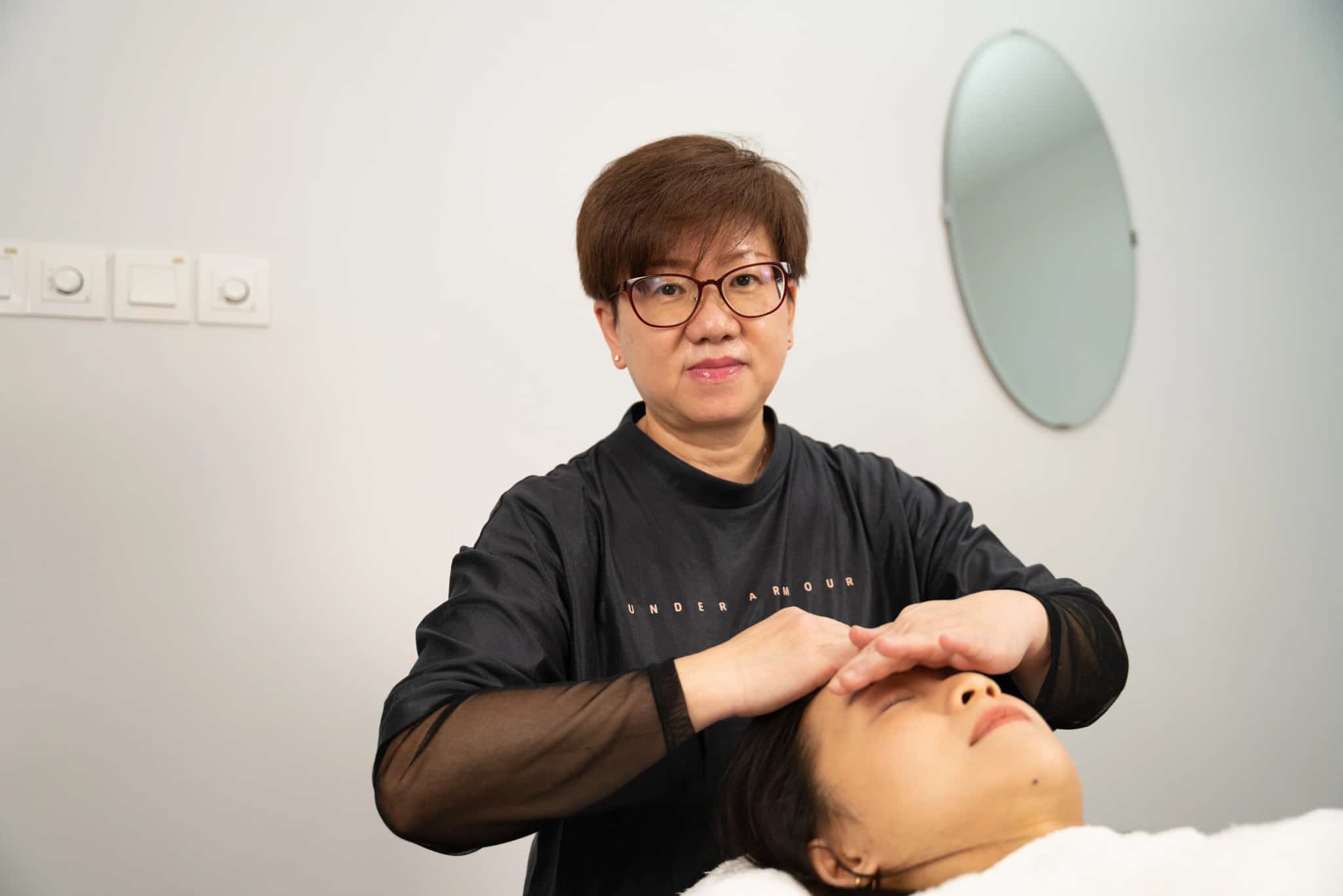 Founder Cynthia giving Customer a face massage